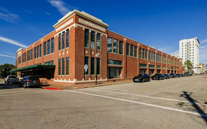 Historic red brick commercial building on a street corner