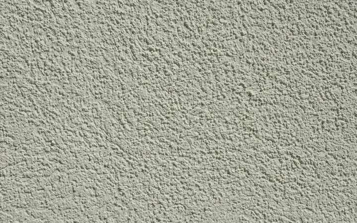 Close-up of a textured stucco wall finish