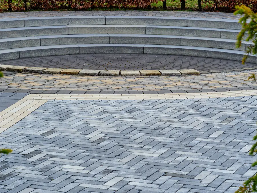 Herringbone paver plaza with stone steps